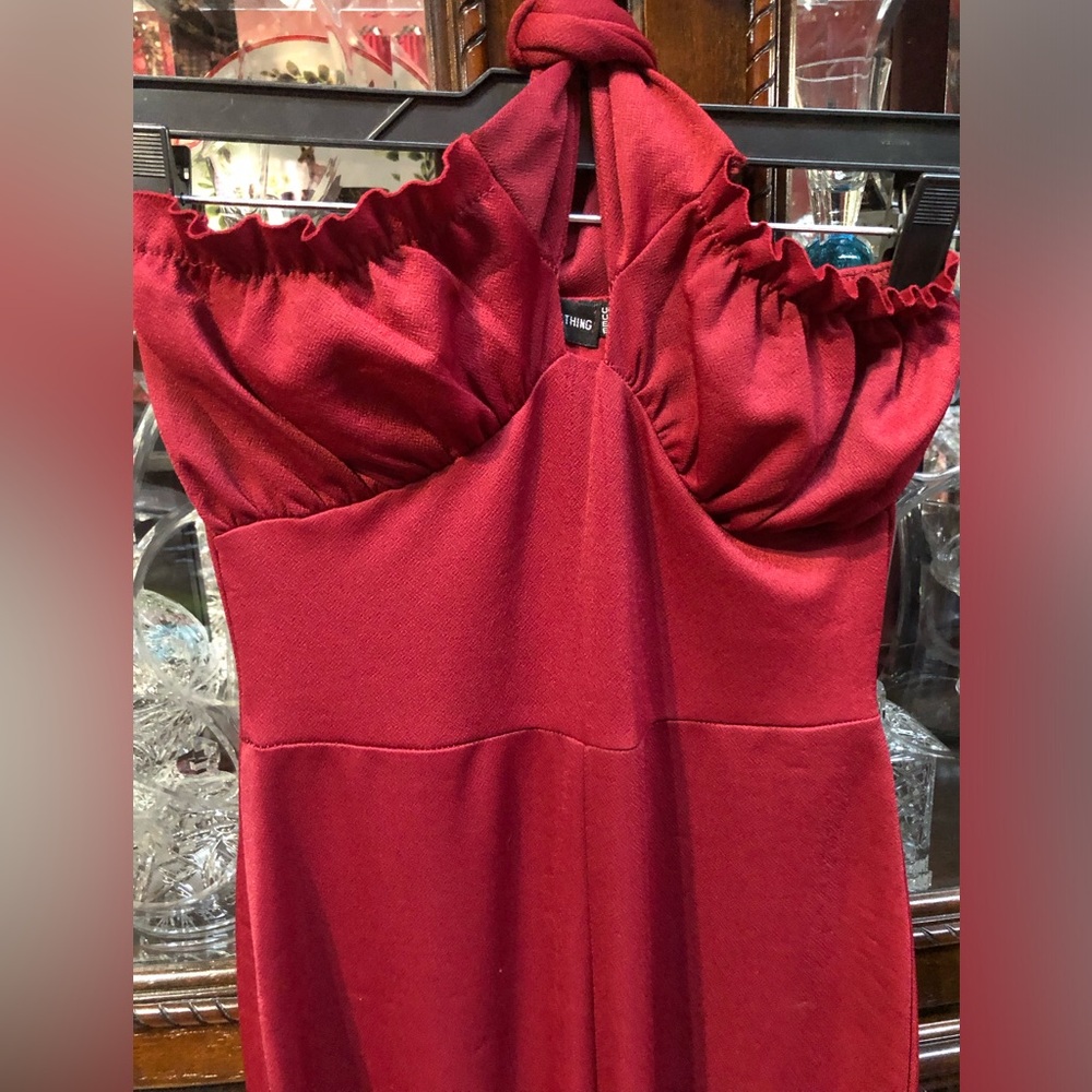 Elegant burgundy halter jumpsuit.